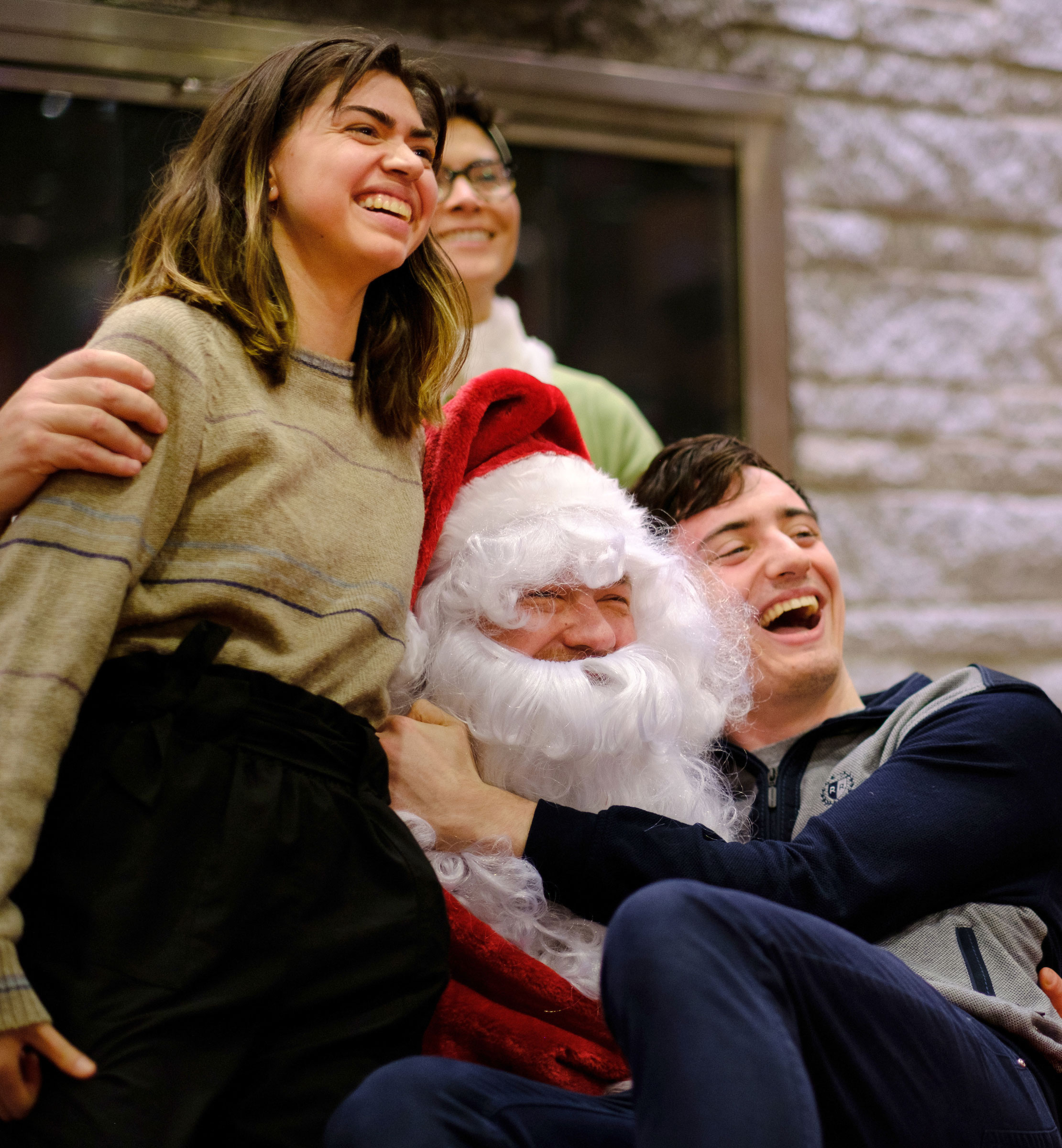 students pose for a portrait with Santa