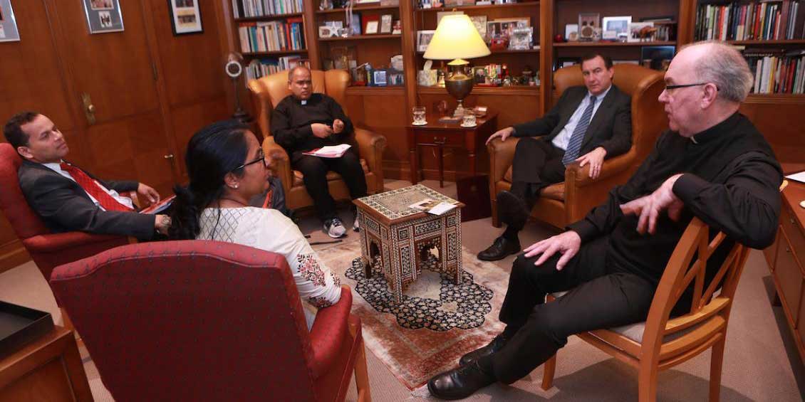 President Stephen Sundborg, S.J., and Seattle University's Joe Orlando meet with professors and representatives from St. Joseph's College in Bangalore, India, who visited campus in late spring.
