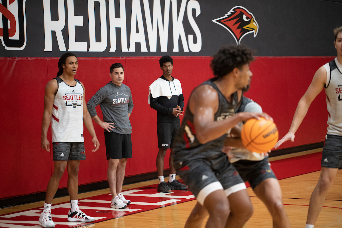 Men's Basketball Head Coach Chris Victor observes players during a recent practice.