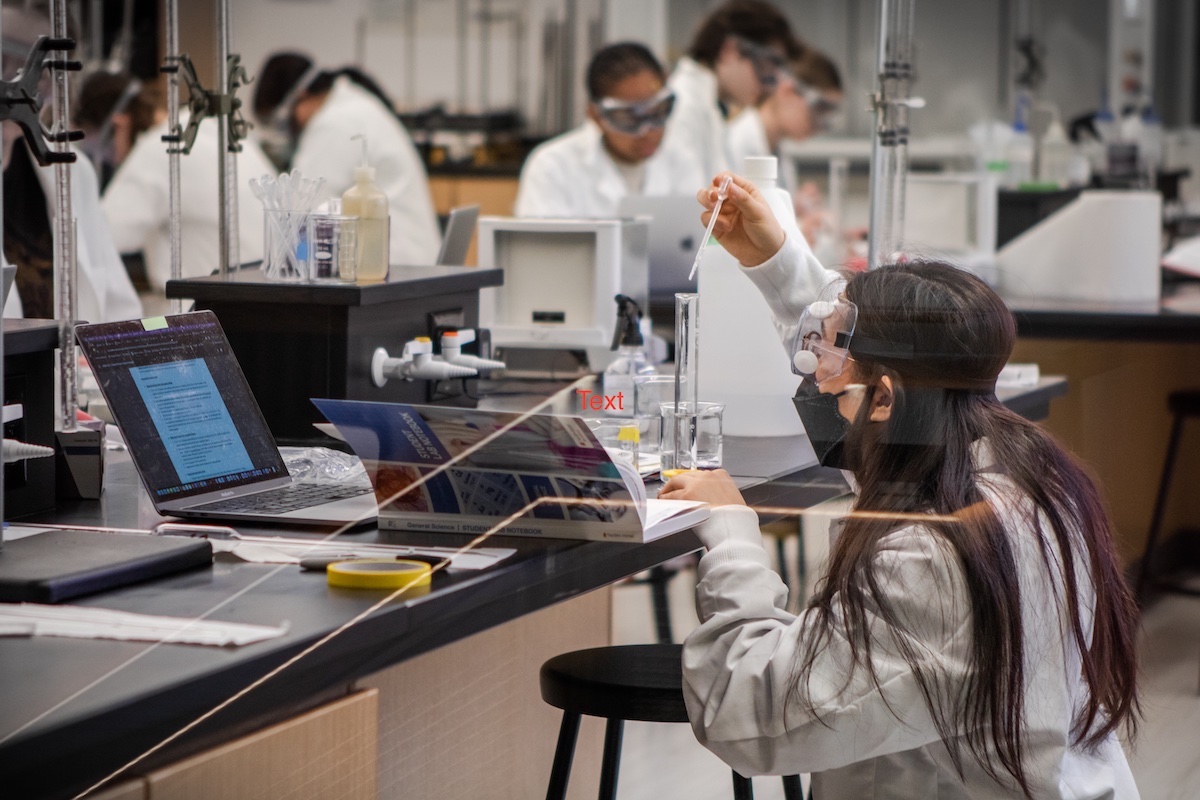 A photo of students working in a lab on campus.