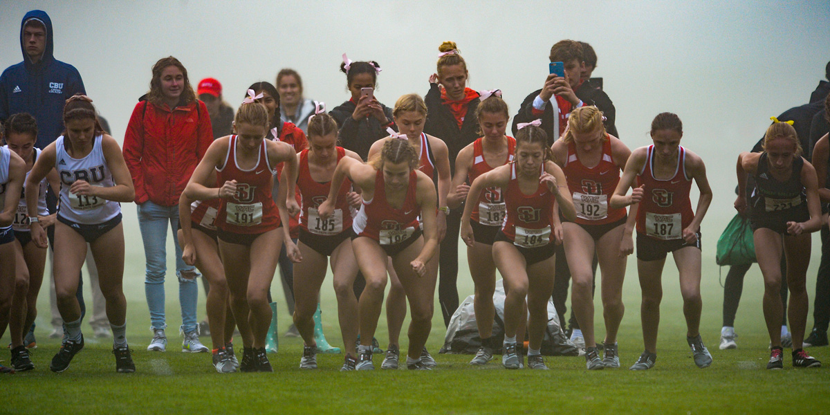 SU Women's Cross-Country Team taking off in a competition