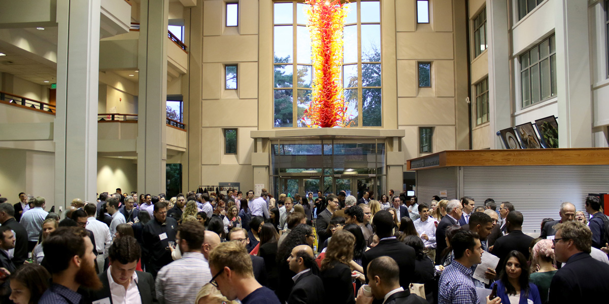 a crowd of people in the Albers Business School Lobby